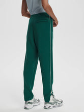 Load image into Gallery viewer, VARLEY THE SLIM PIPED PANT 27.5&quot; - FOREST
